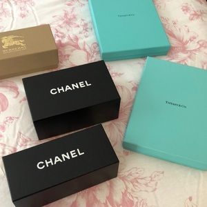 5 designer boxes. Two Chanel, one, Burberry, two Tiffany.
